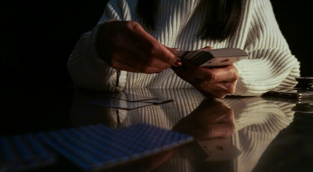 person collecting stamps at table