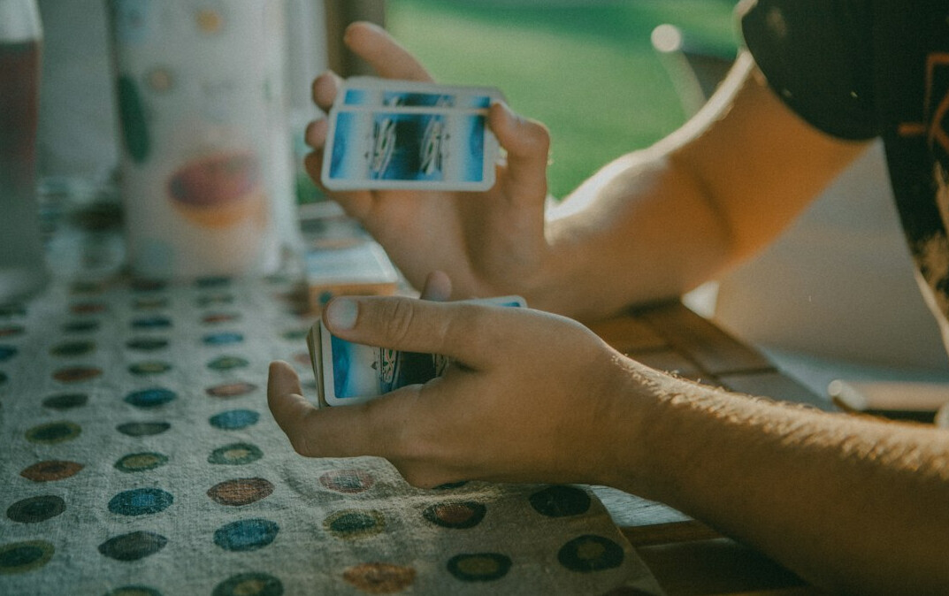 person collecting stamps at table