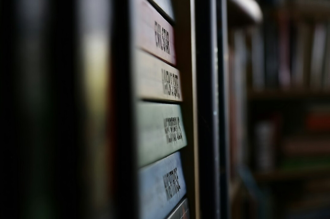 old books on wooden shelf