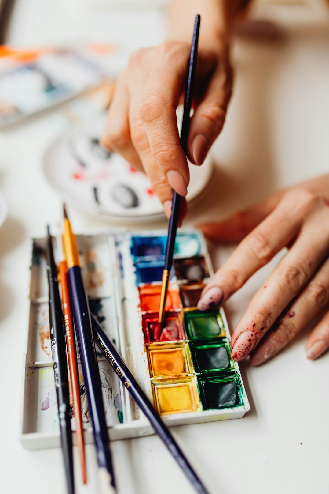 person painting canvas